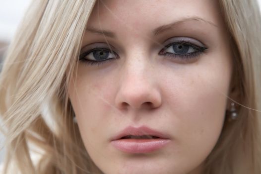 Portrait of the beautiful girl with light hair close up