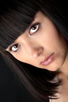 The person of the beautiful girl close up on a black background