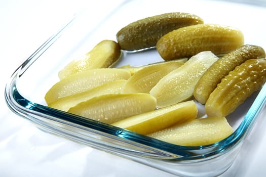 The cut and whole pickles in glasswares