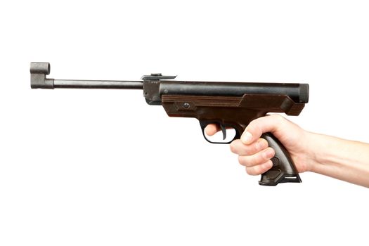 The man's hand holds pneumatic pistol on a white background
