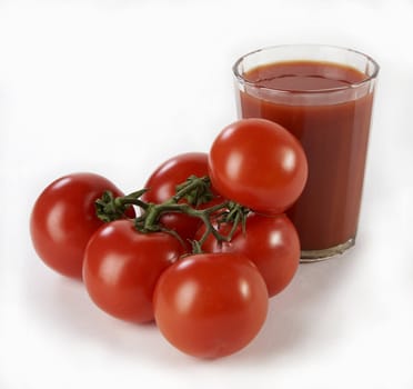 Tomatoes with juice on a white background