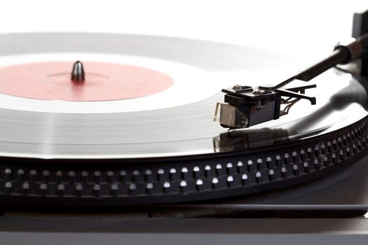Old  player and vinyl phonograph record on a white background
