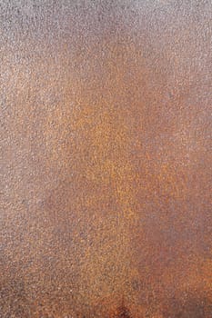 Wet rusty sheet of iron shined by the sun