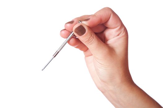 female hand holds a small screw-driver on  white background