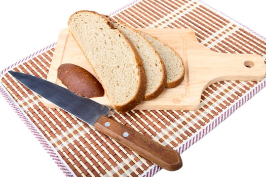 Slices of bread  knife chopping board on a white background