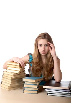 The girl with pile of books and writing-books on a white background