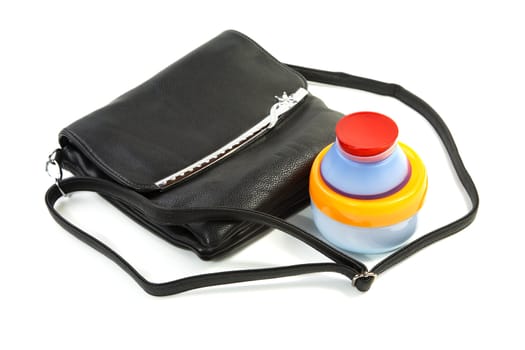 Female bag and cosmetics isolated on a white background