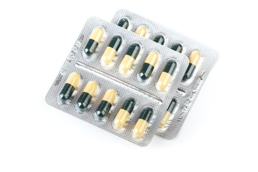 Medicines in capsules on a white background