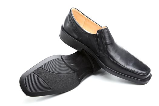 Pair of black man's shoes on a white background