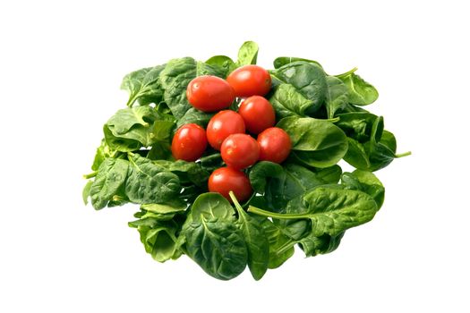 Baby spinach and cherry tomatoes isolated against white background