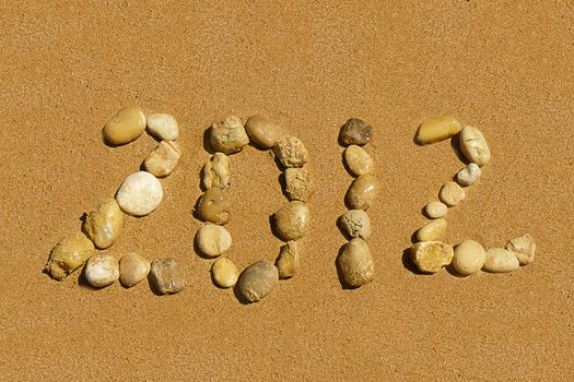 2012 inscription on the golden sand beach