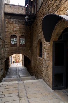 Vertical oriented image of old street in historic part of Akko, Israel
