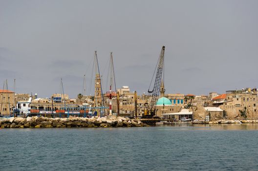 View on the ancient walls, houses and mosque in old town of Akko, Israel