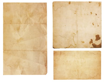 Collection of three aged, worn and stained paper scraps isolated on white with room for text or images.