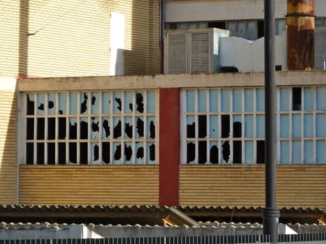 broken windows on an unused building