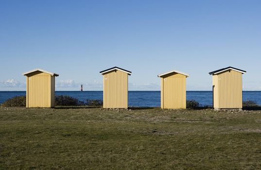 Row of boathouses on a sunny day