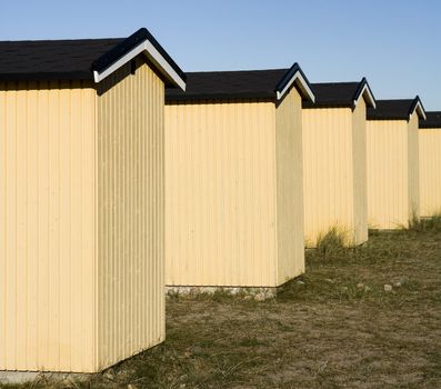 Row of boathouses on a sunny day