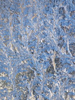 Abstract frosty natural pattern on a winter window. 