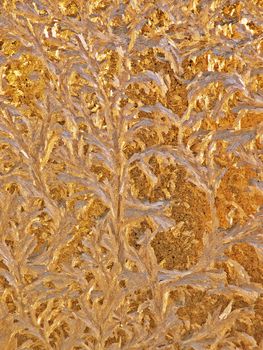 Abstract frosty pattern in golden color painted.