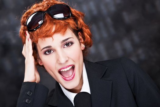 Happy red hair happy business woman with big sun glasses