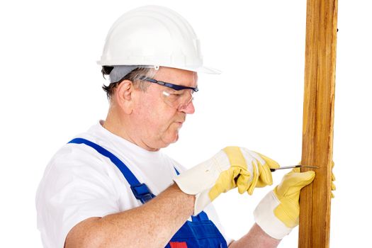 Middle age worker screwing nail in board, isolated on white background