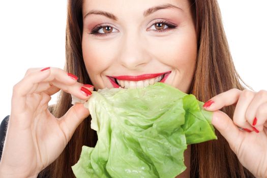 close up look of brunette woman eating green salad, isolated on white