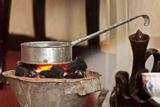 Roasting coffee beans to make coffee the traditional way