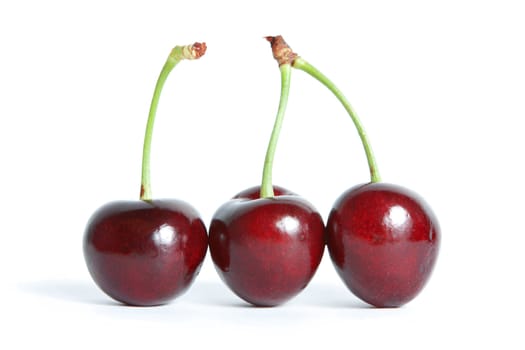 three red cherry isolated on a white background.