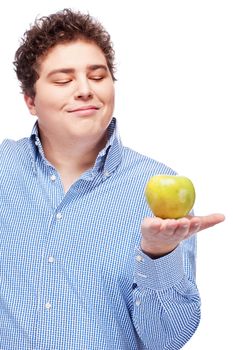 Happy chubby man holding apple, isolated on white