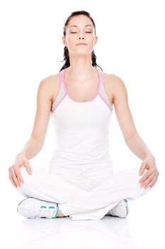 Woman relaxing on the floor after exercise, isolated on white background