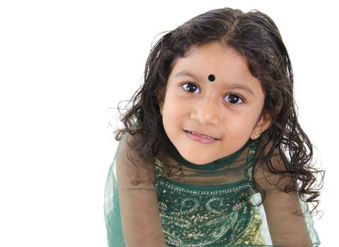 Little Indian girl looking up over white background