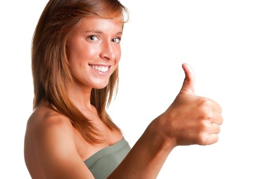 Attractive young woman giving the thumbs-up, isolated on a white background