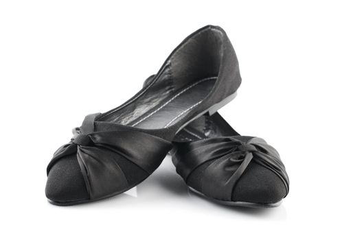 Pair of black casual woman shoes on white background