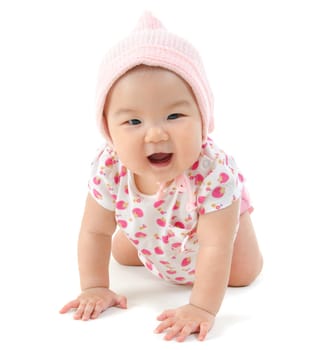 Six months old baby girl crawling over white background