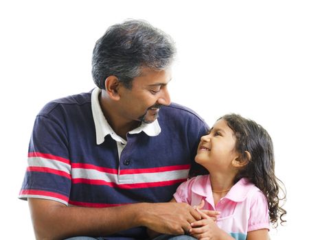Asian Indian father having conversation with her daughter over white background