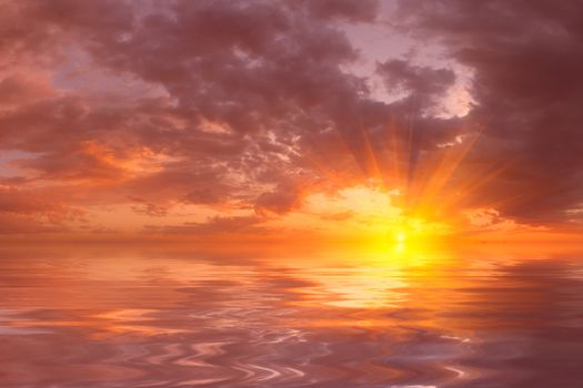 Beautiful sunset over sea with reflection in water, colorful clouds in the sky