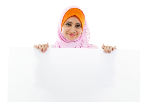 Young Muslim woman holding a white board