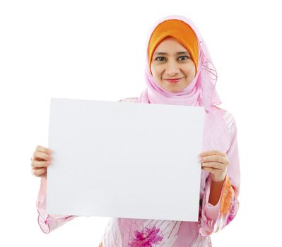Beautiful Young Muslim girl holding a white card board over white background