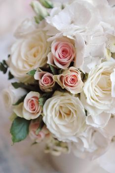 Wedding bouquet of white roses closeup. Small depth of field