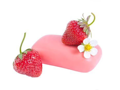 Natural soap with a strawberry and flower isolated on white background