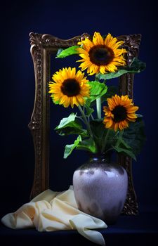 Still life with sunflowers  on dark blue background