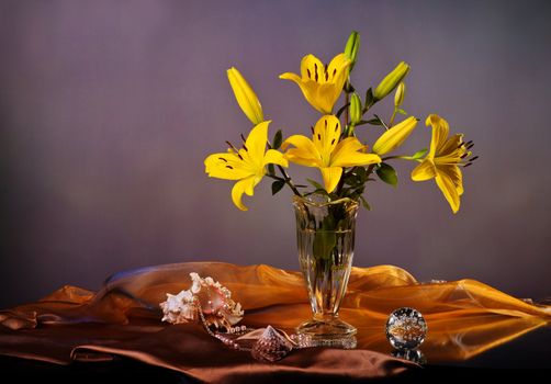 Still life with yellow lily and pearls