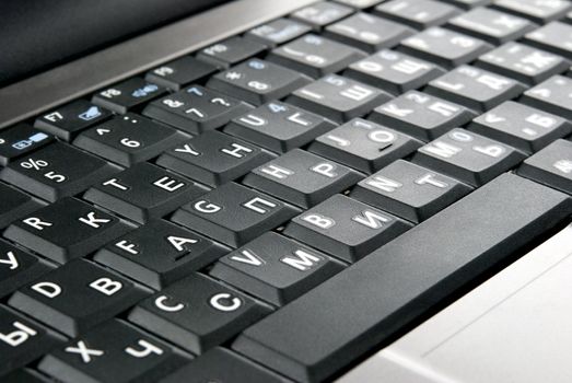 Laptop keyboard closeup. Oblique view