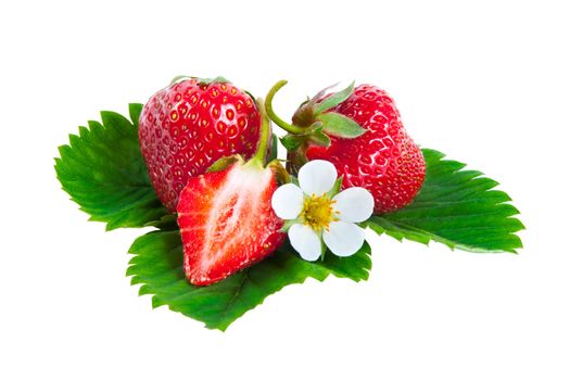 Whole and half strawberries on green leaves with flower isolated on white background