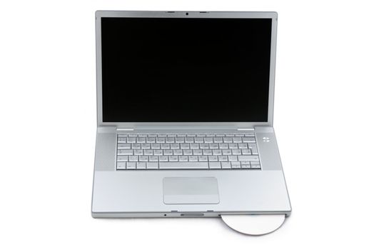 Silver portable computer with CD inserted. Front view.