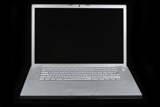 Silver portable computer. Front view.