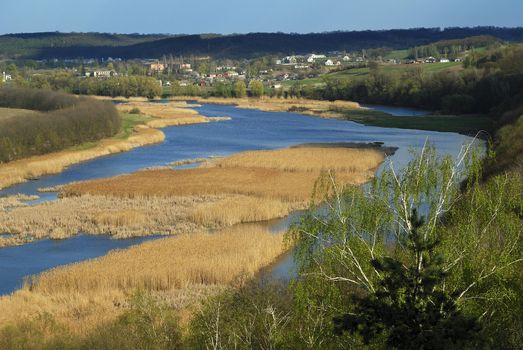 Small village riverbank at spring