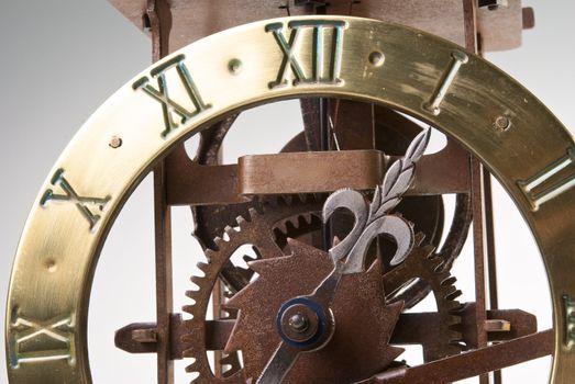Antique looking clock dial showing time about twelve