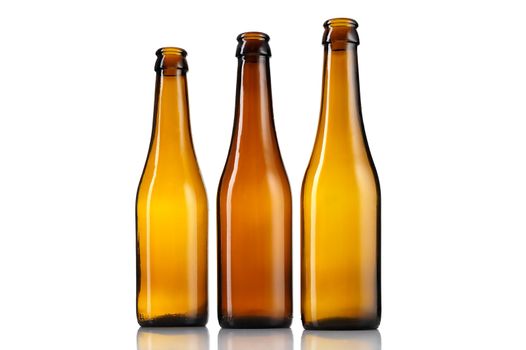 Three empty bottles of beer isolated on white background.