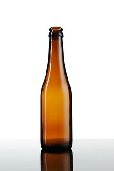 Empty bottle of beer isolated on white background.